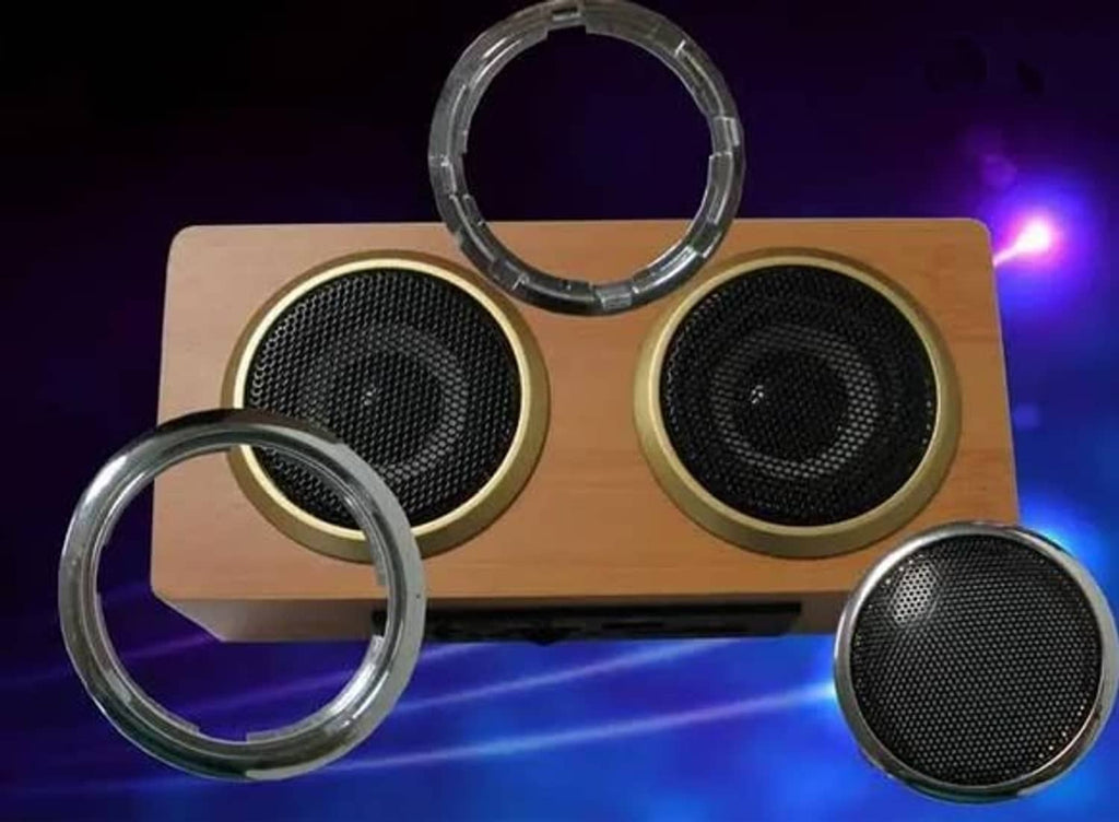 Clear circular speaker surround rings with metal speaker grilles.