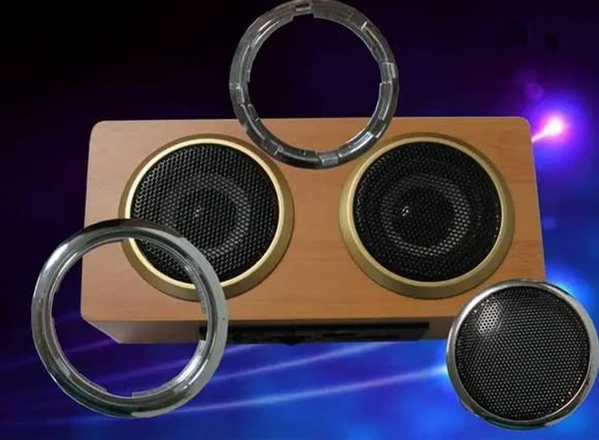 Clear circular speaker surround rings with metal speaker grilles.