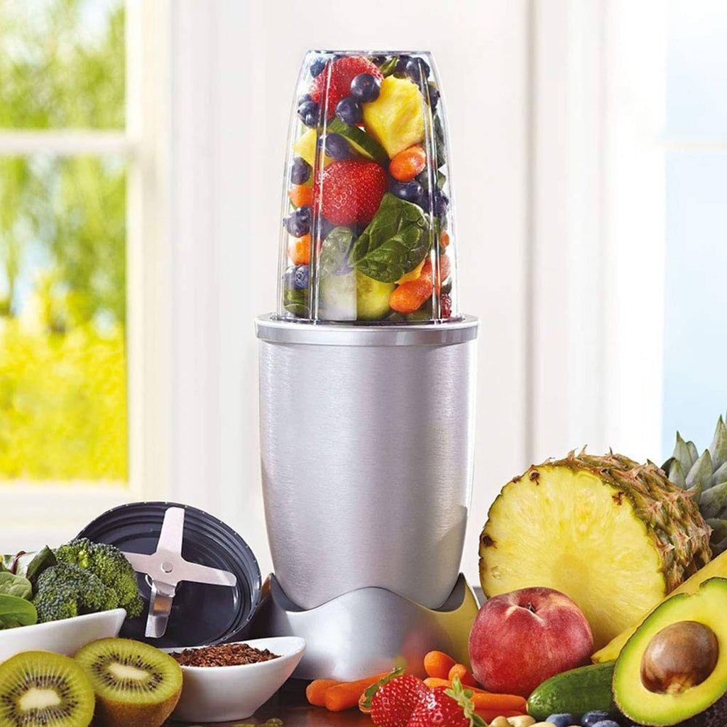Tall blender cup with mixed fruit on stainless base and detachable blade