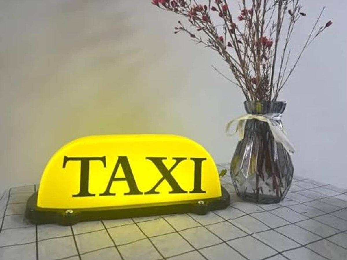 Yellow TAXI dome LED car sign light with dark base