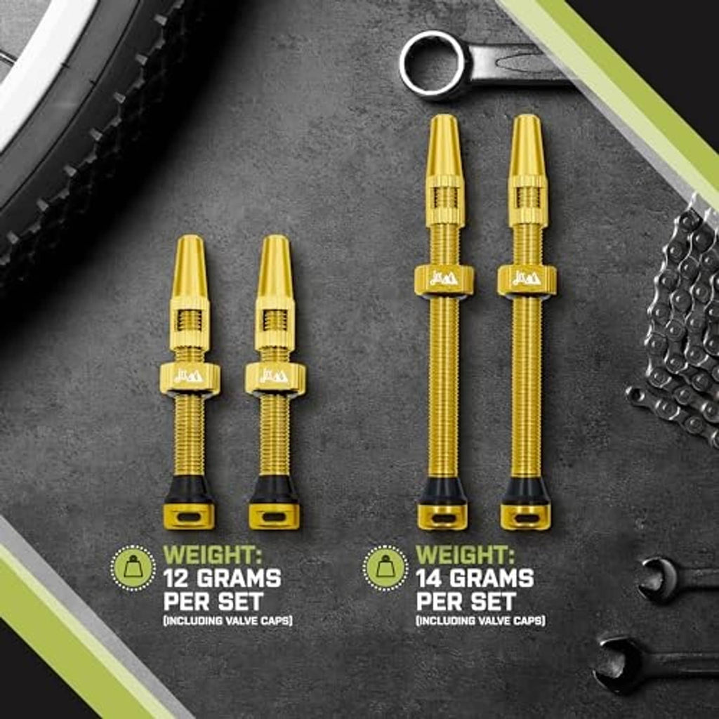 Gold anodized Presta tubeless valve stem pair with threaded metal shaft and black base.