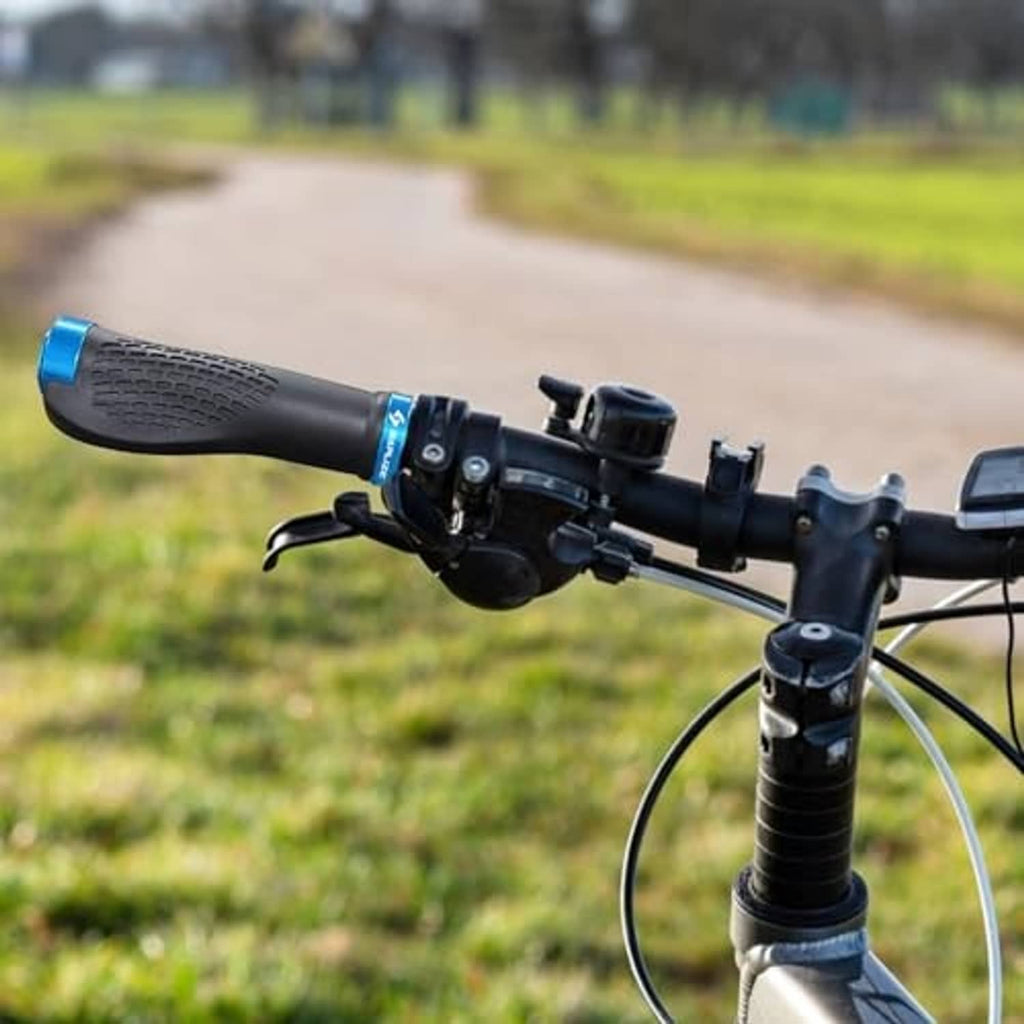 Black bike handlebar grips with textured grip and blue accent on end cap