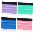 Set of 4 small felt squeegees with black grip straps, in purple, green, blue, and pink