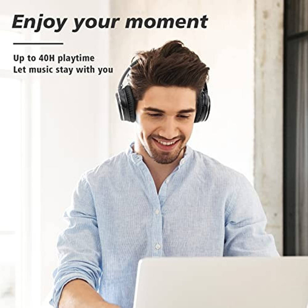 Over-ear black headphones worn by a man with padded ear cups and headband