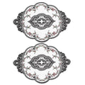 2-pack oval lace placemats with black ornate embroidery and small floral accents