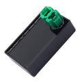 Black CDI module box with green connector plug, angled