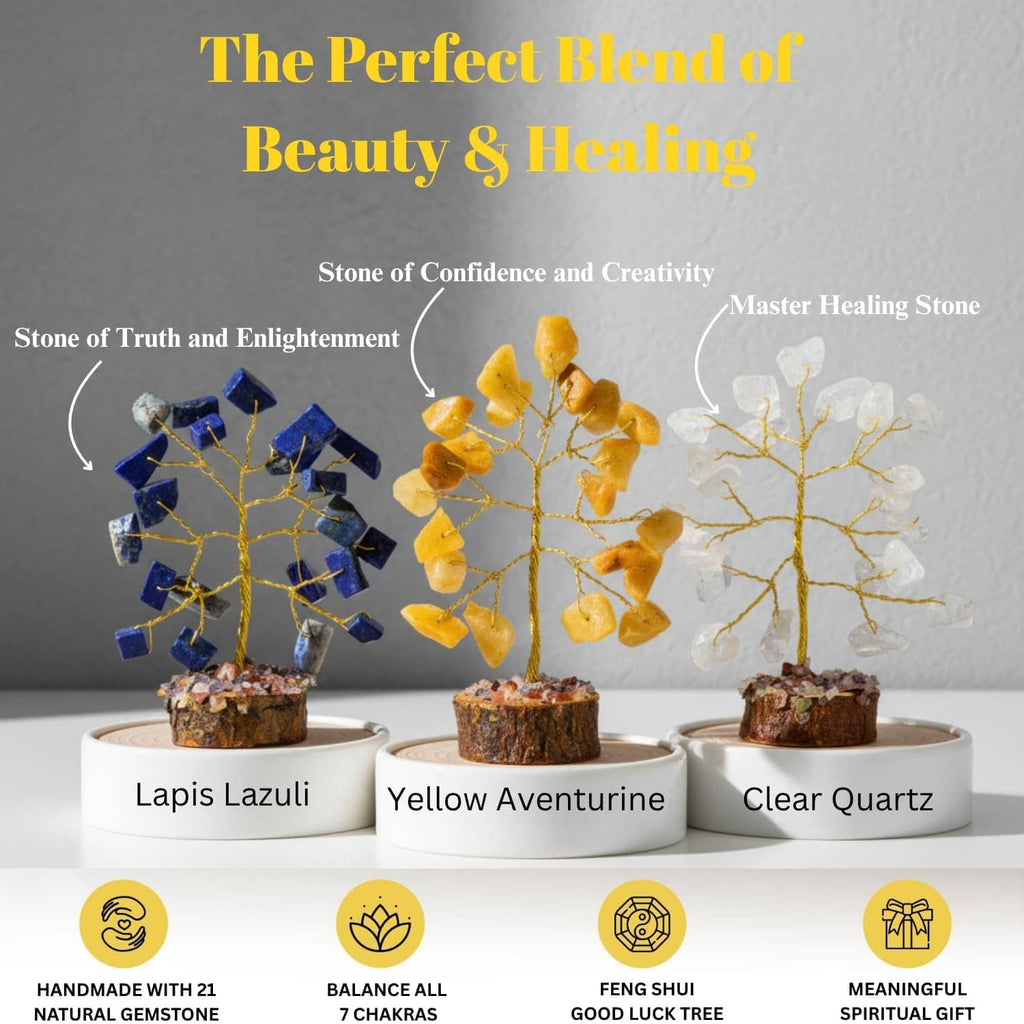 Three gemstone crystal trees: lapis lazuli, yellow aventurine, and clear quartz on bases.
