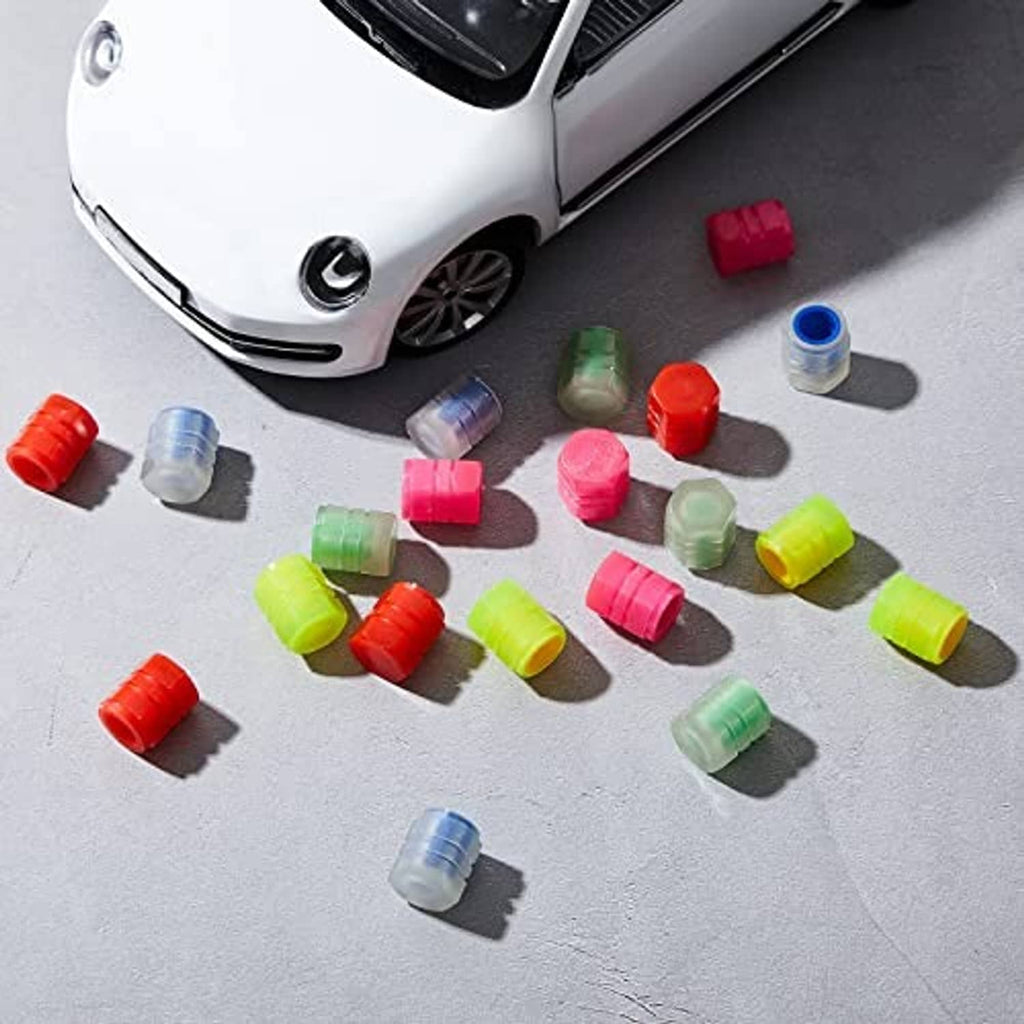 Set of glow-in-the-dark tire valve caps in red, blue, pink, green, and yellow tones