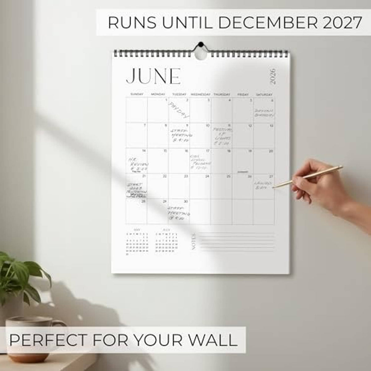 June wall calendar with 'Runs until December 2027' header, spiral binding, date grid