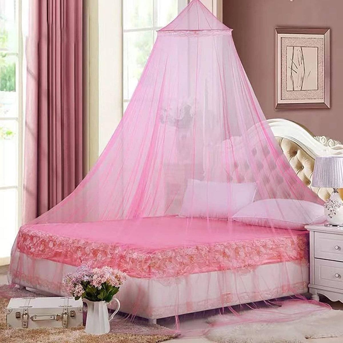 Pink sheer bed canopy mosquito net with domed top and ruffled trim
