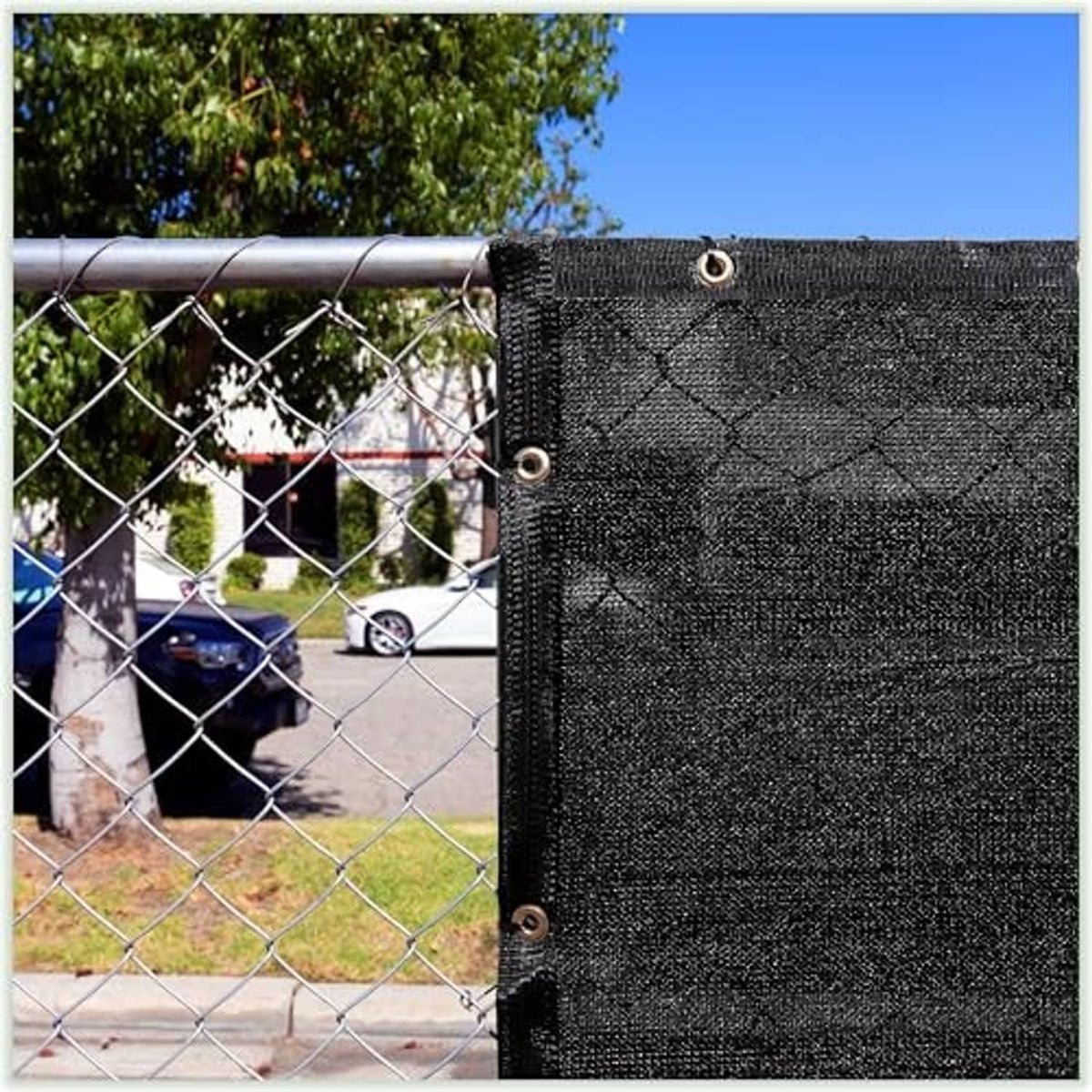 Black shade cloth tarp with multiple metal grommets on the top and side