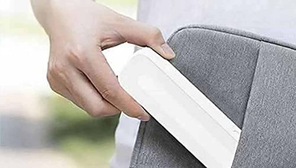 Hand sliding a white and teal stylus case into a protective cover