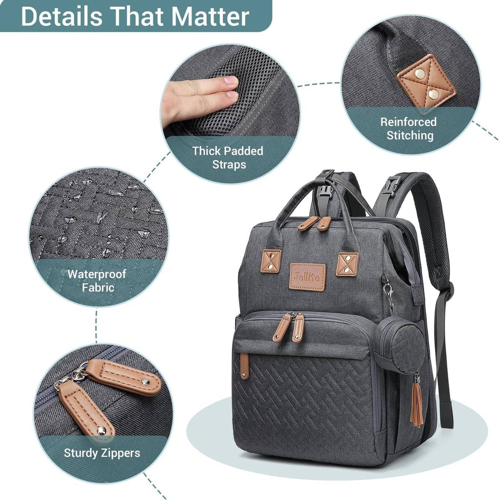 Grey diaper bag backpack with thick padded straps and waterproof fabric detail