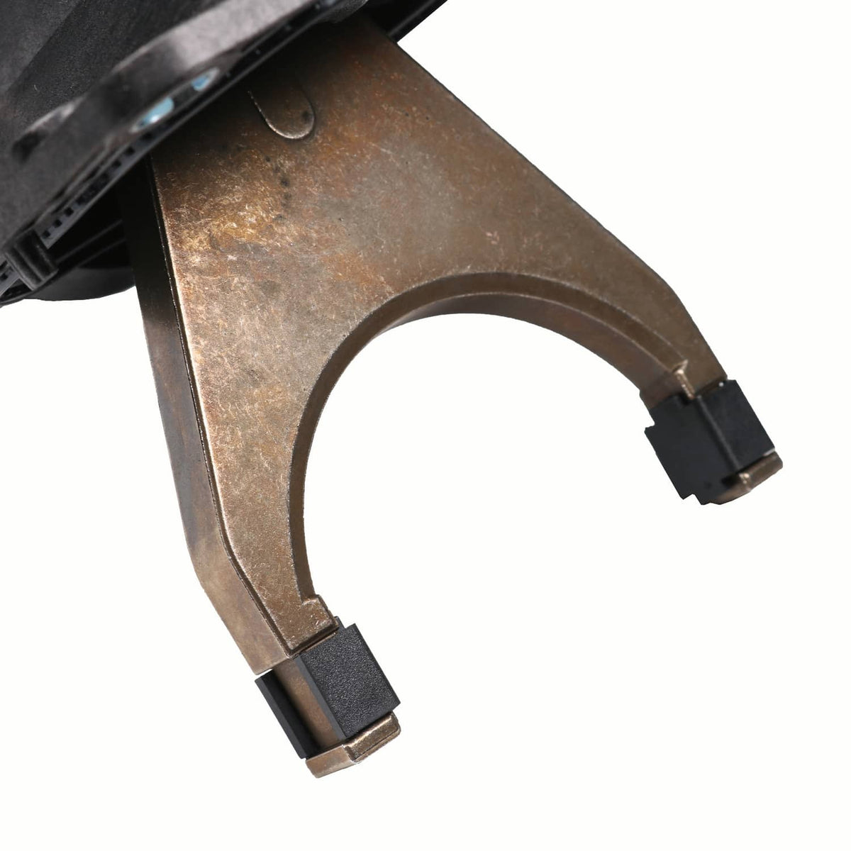 Metal fork end of front axle disconnect actuator with two dark connector tabs