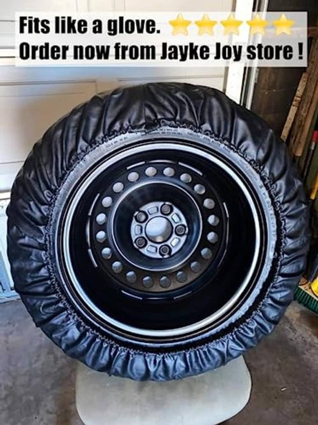 Spare tire cover fitted over a steel wheel, round black cover with gathered edge