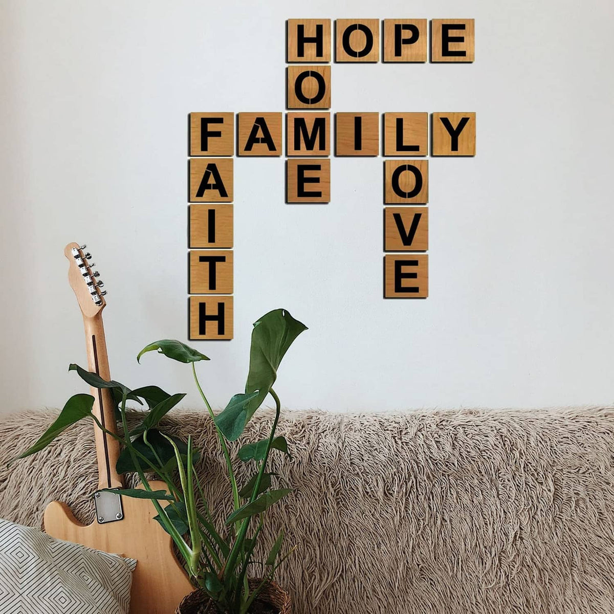Wall decor with stencil-style block letters spelling HOPE, FAMILY, and LOVE