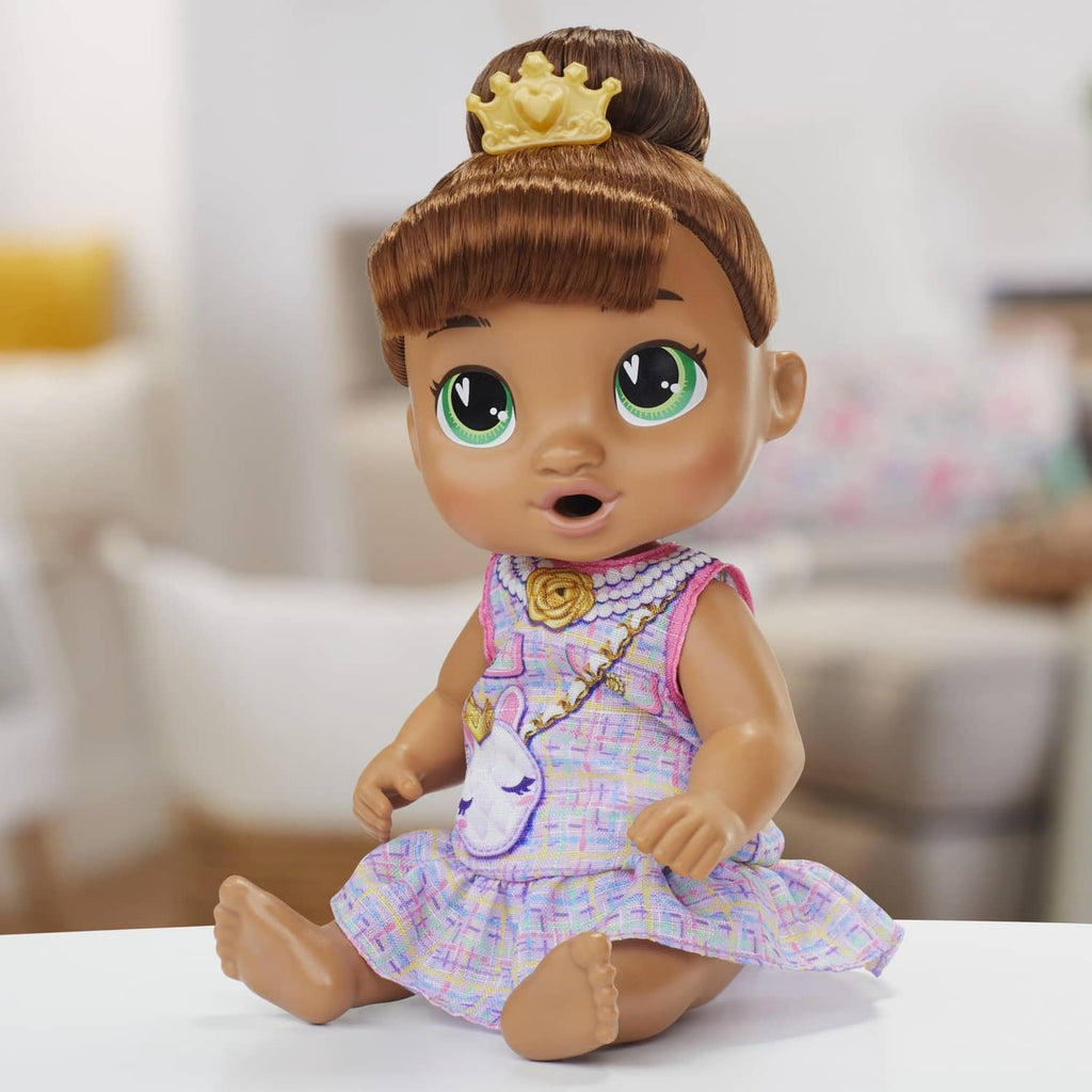 Sitting Sophia Sparkle doll in pastel unicorn dress with gold hair crown
