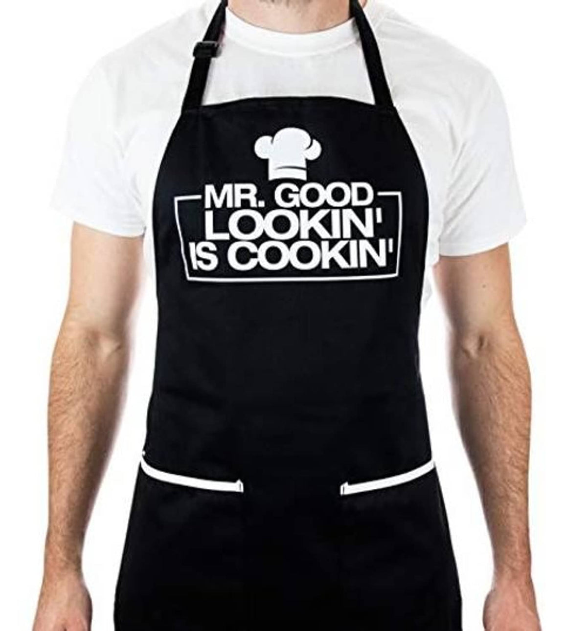 Black apron with chef hat chest graphic, adjustable neck strap, and two front pockets