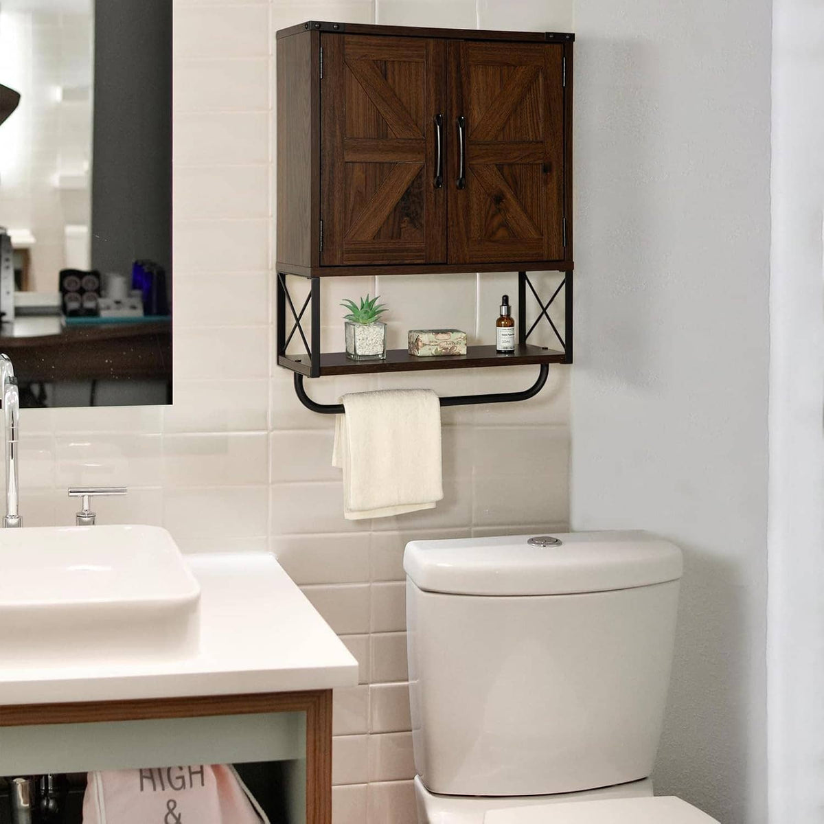 Wood wall-mounted medicine cabinet with barn doors and open shelf under a bathroom mirror view