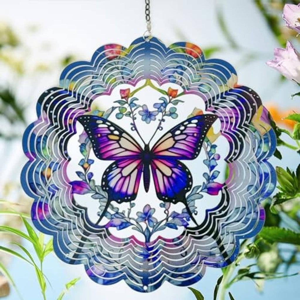 Butterfly wind spinner hanging with purple wings, blue flowers, and iridescent ring edges