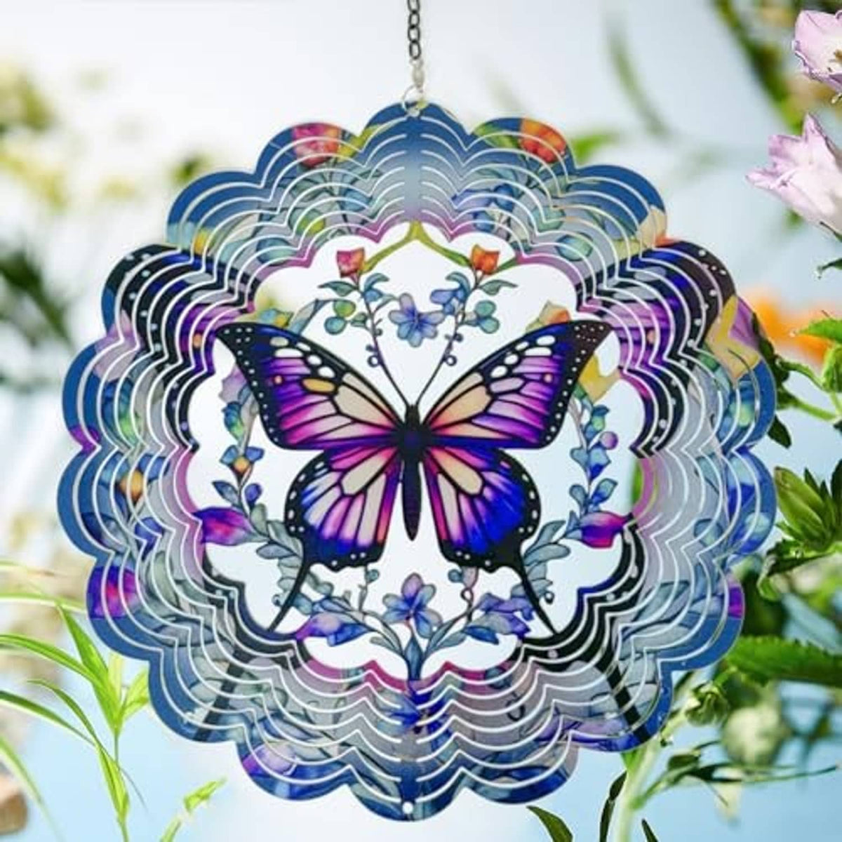 Butterfly wind spinner hanging with purple wings, blue flowers, and iridescent ring edges