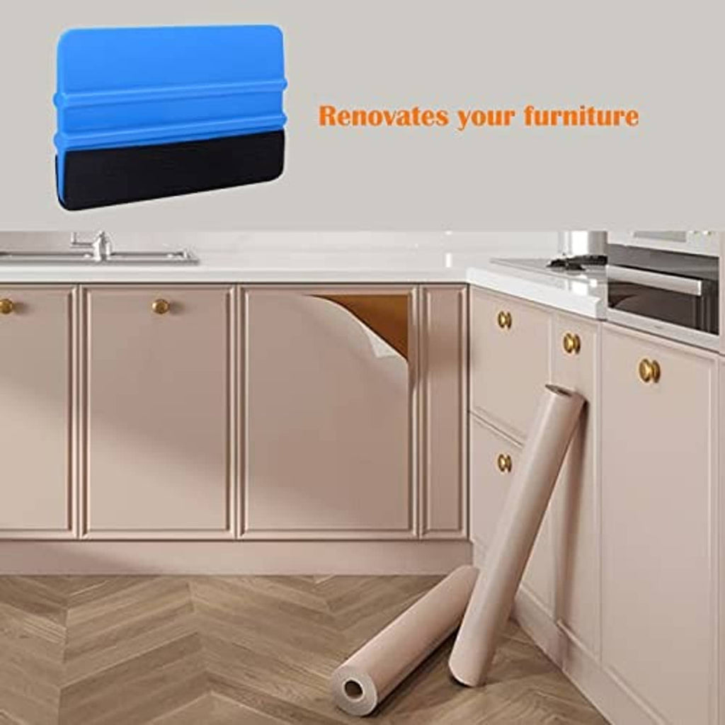 Gloved hand holding blue vinyl squeegee with black felt edge, curved corner