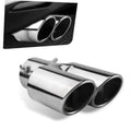 Stainless steel dual-outlet exhaust tip with two round openings, mounted on a car bumper