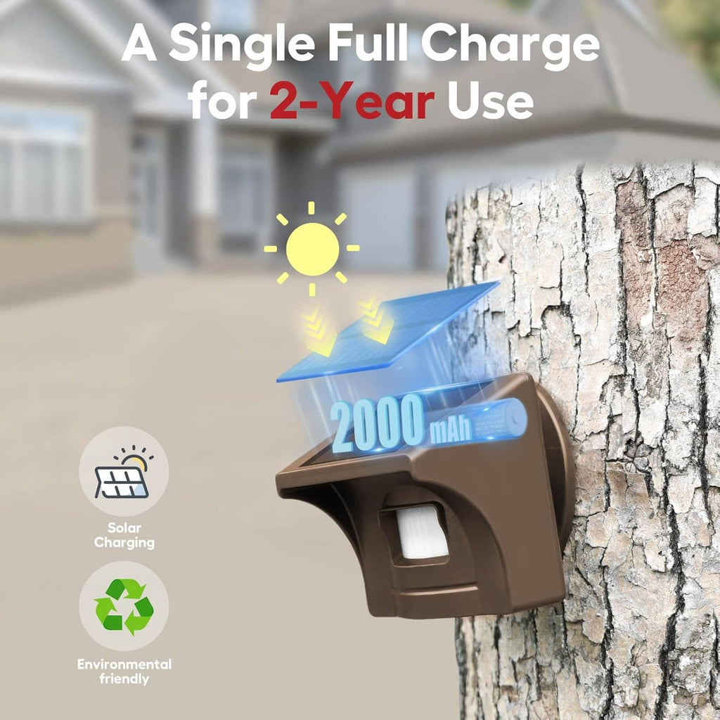 Solar driveway alarm sensor mounted on outdoor wall with charging indicator