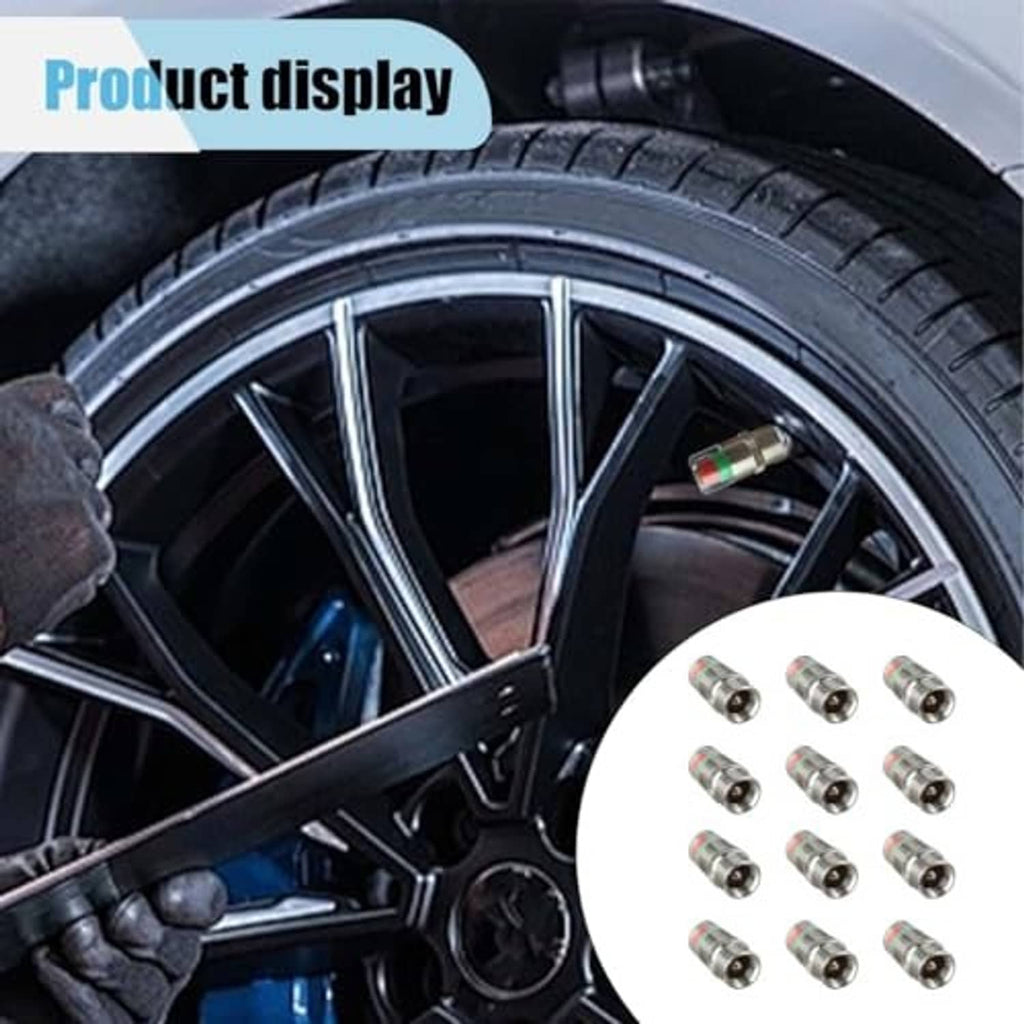 Tire valve stem caps installed on a car wheel, with green/amber/red indicator eyes