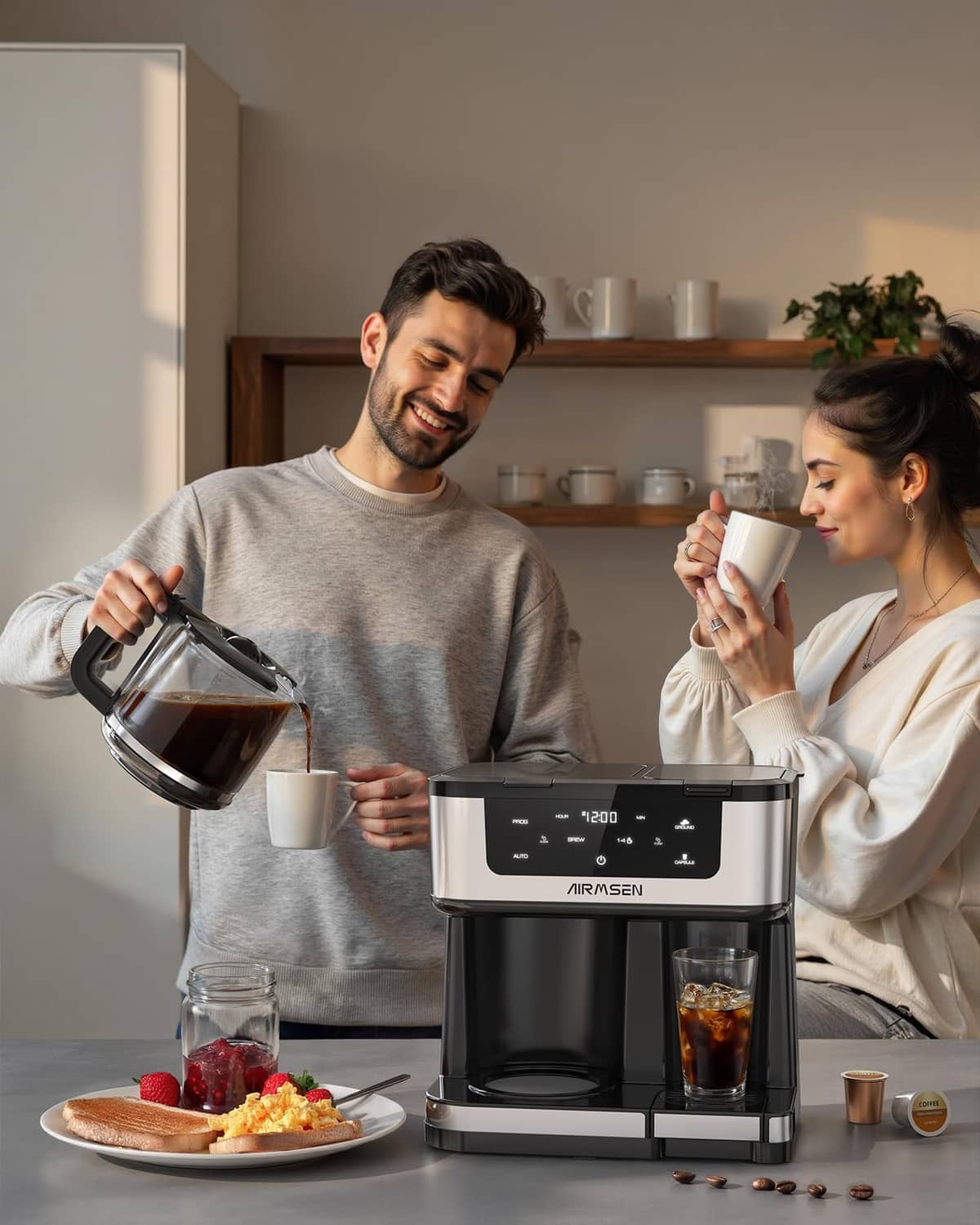 AIRMSEN dual coffee maker with two cups, glass carafe, and black and stainless body