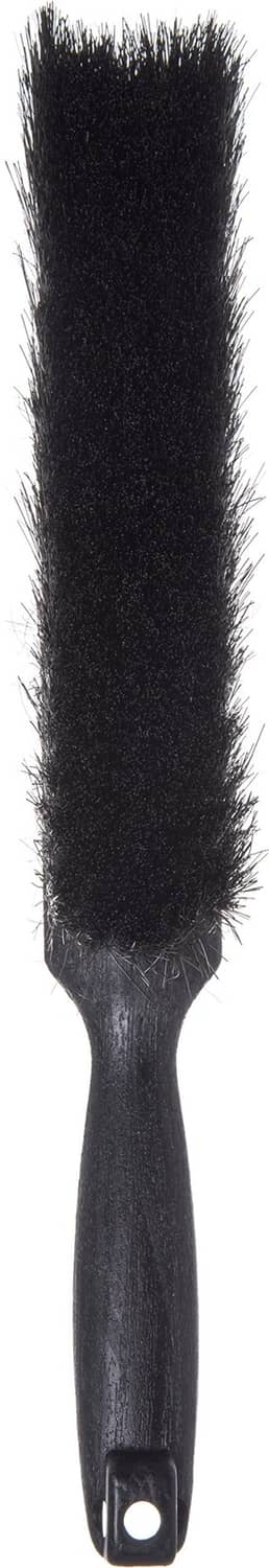 Black counter brush with vertical dense bristles and hanging loop handle
