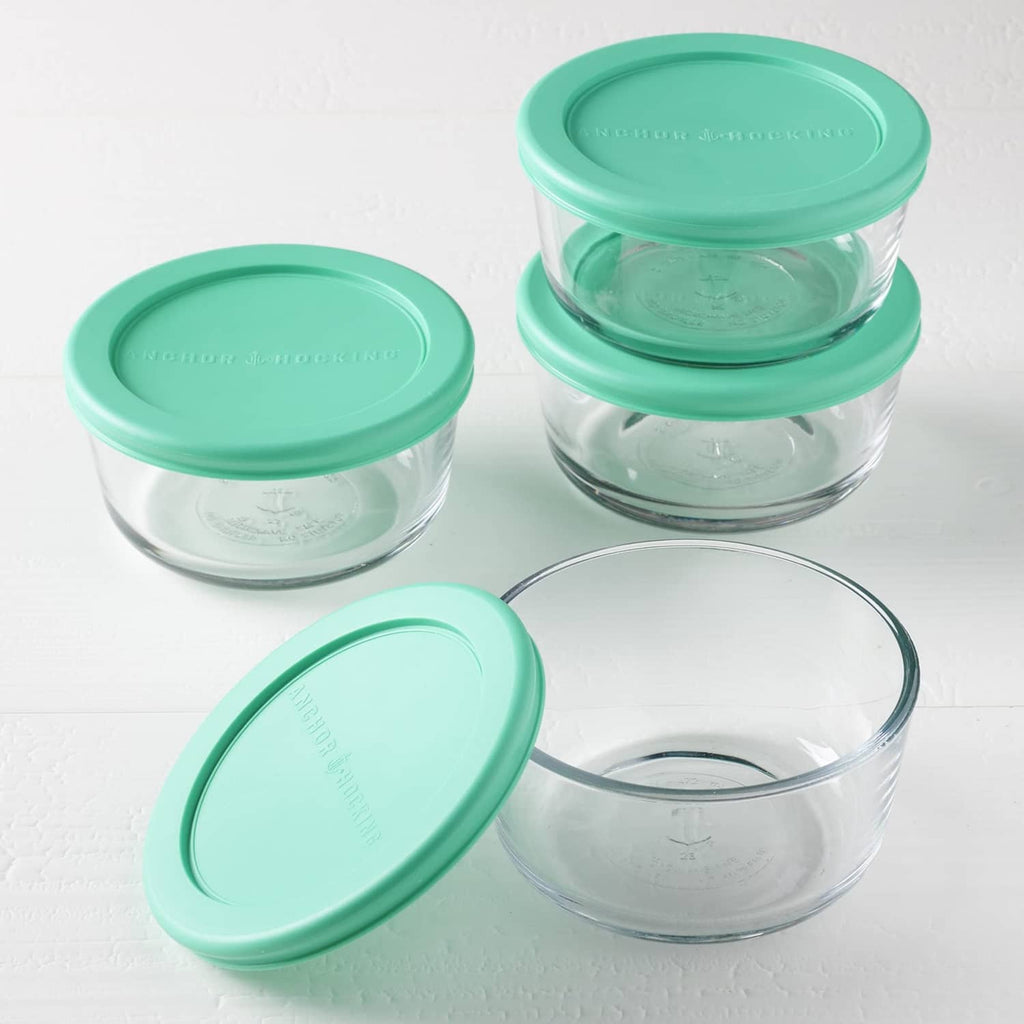 Round glass storage containers with teal lids, mixed set arrangement