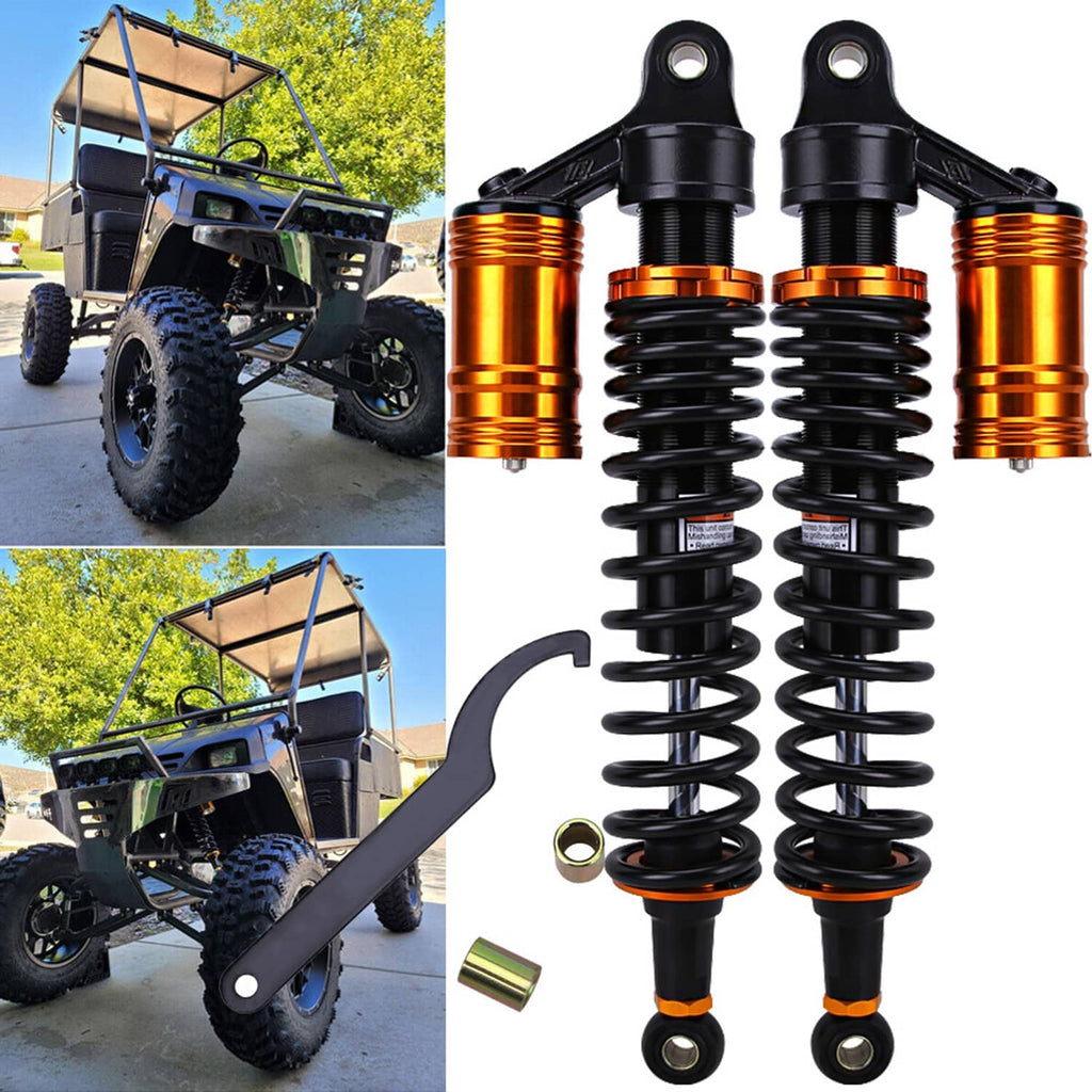 Rear air shock absorbers installed on an ATV, black springs with orange reservoirs