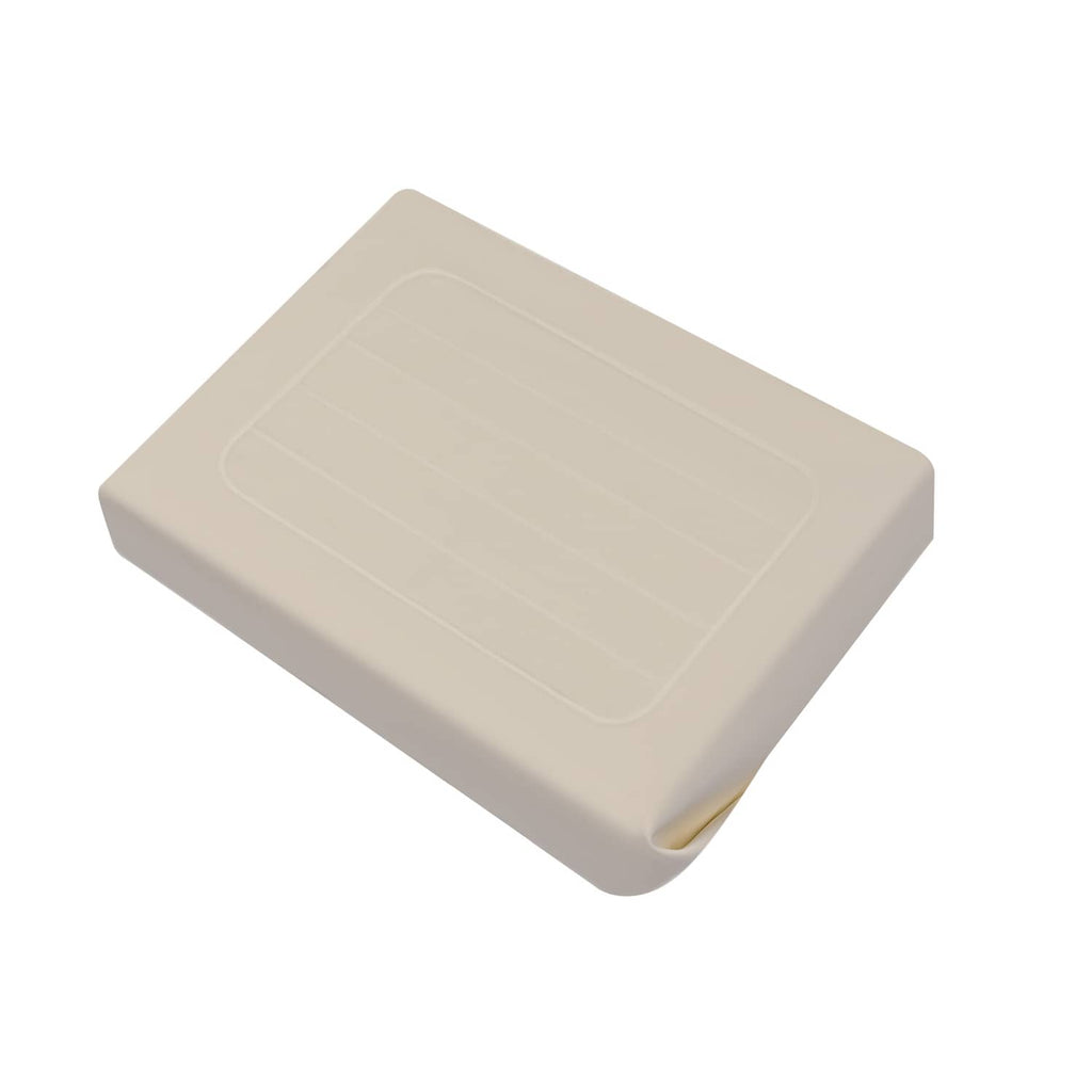 Light beige seat back cover with molded rectangular panel and small side opening