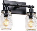Black 2-light vanity light with two clear mason-jar glass shades and exposed bulbs