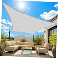 Light grey rectangular sun shade sail with curved edges, stretched across support posts