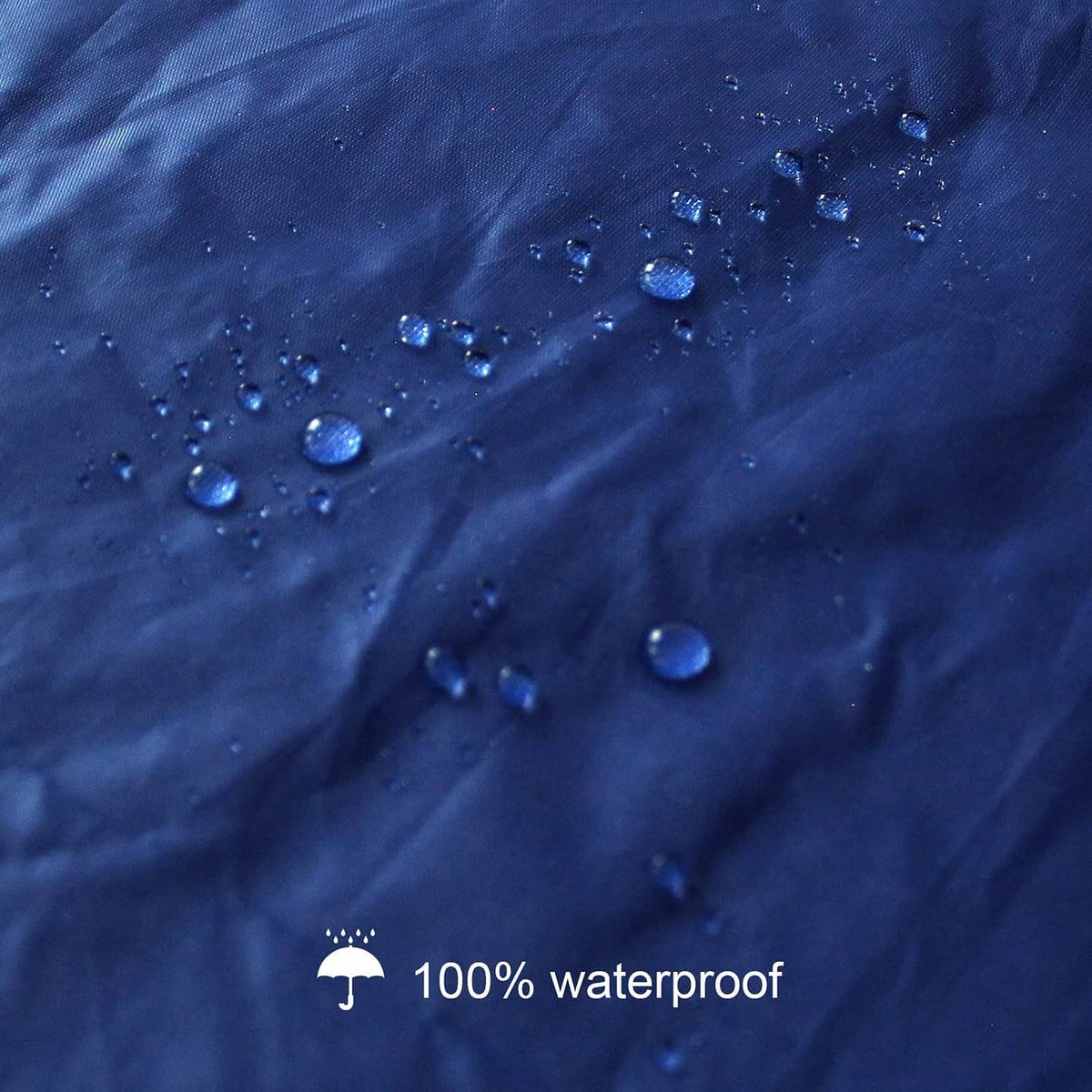 Navy waterproof mattress cover fabric with water droplets beading on the surface