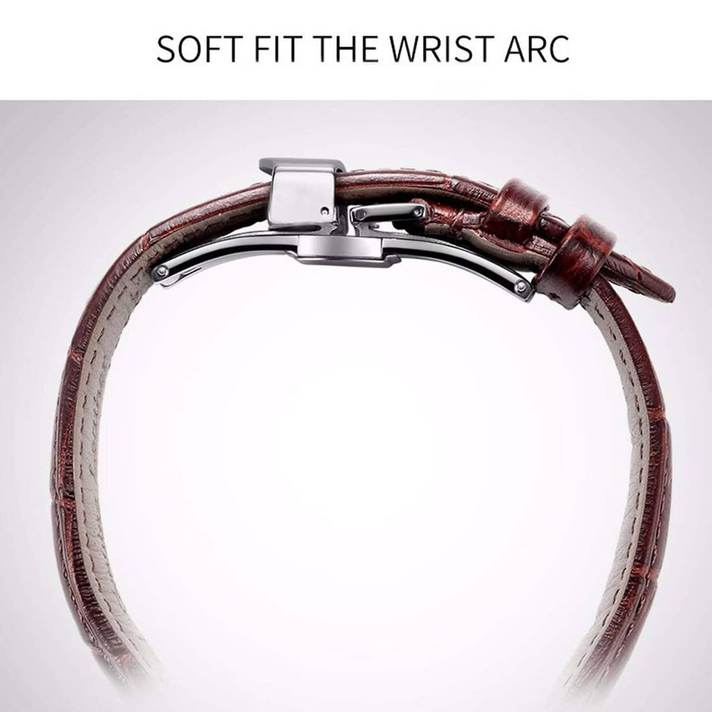 Silver deployant clasp on brown leather watch strap, arched fit close to case