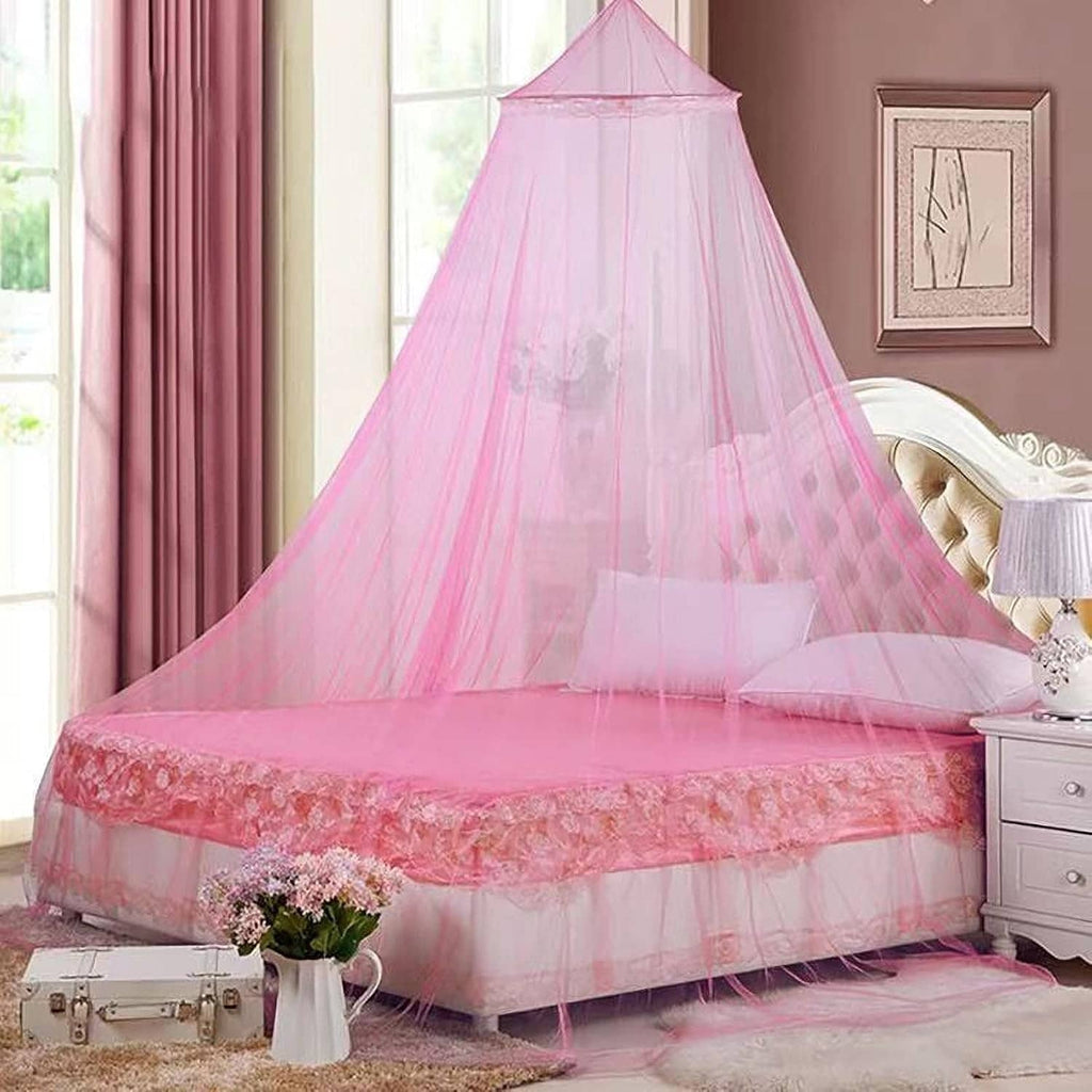 Pink sheer bed canopy mosquito net with domed top and ruffled trim