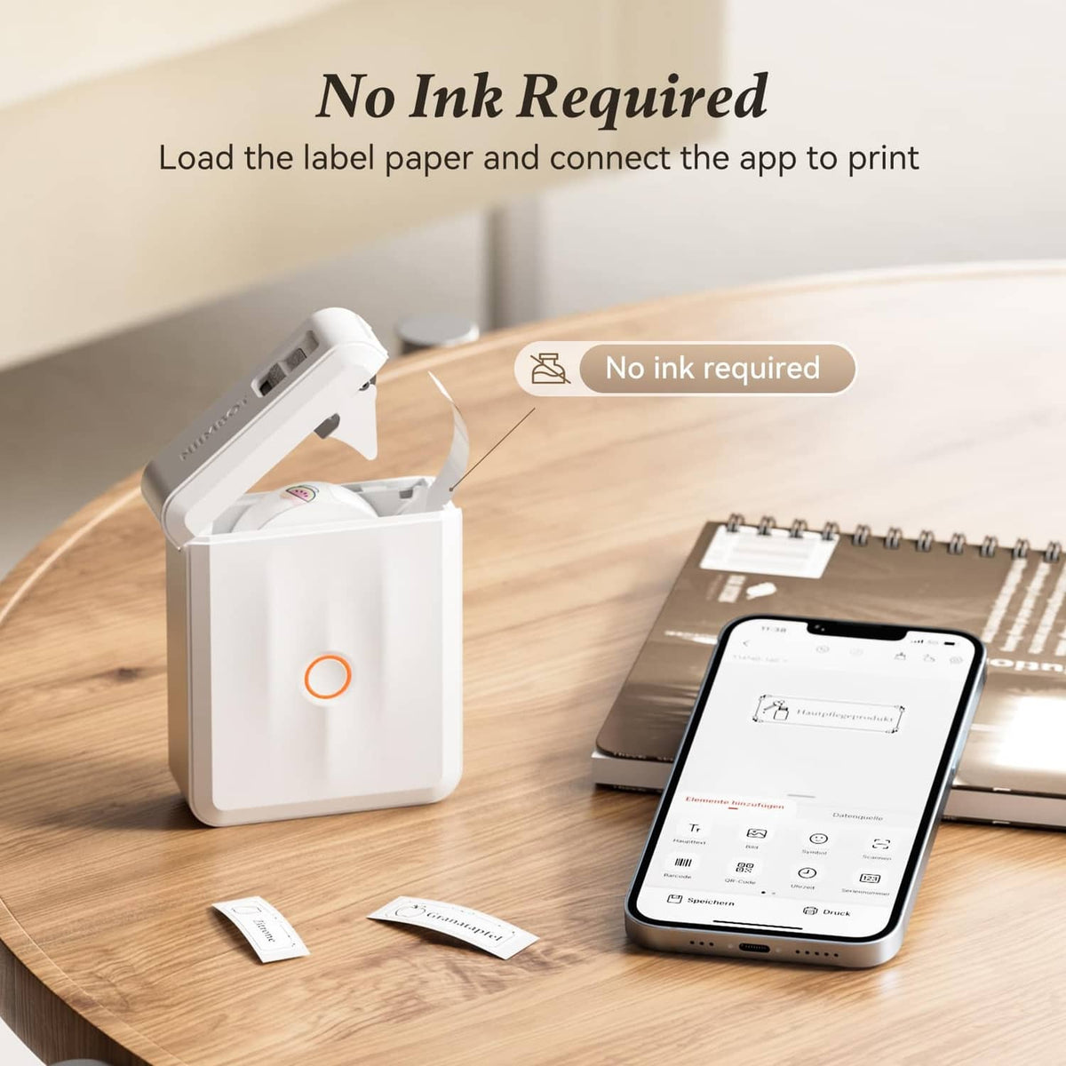 White inkless thermal label maker with open paper tray and smartphone preview