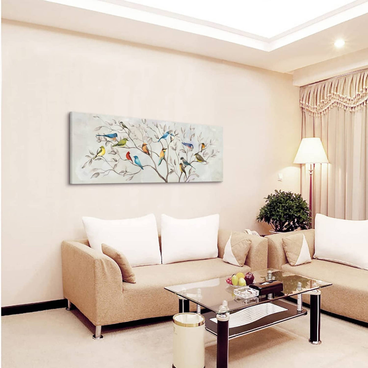 Rectangular bird and tree branch canvas wall art above sofa with colorful birds