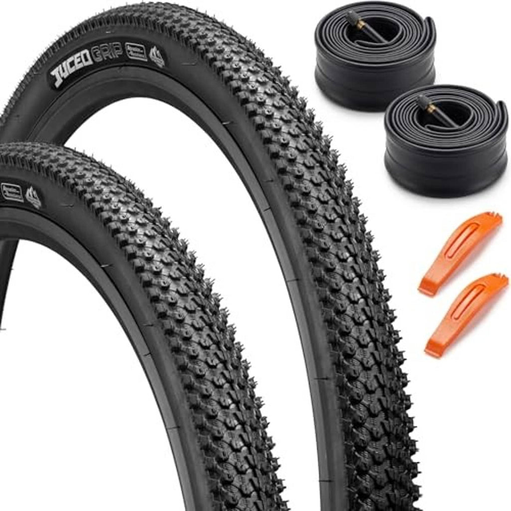 Pair of black 26x1.95 folding bike tires with two rolled inner tubes and orange valve tools