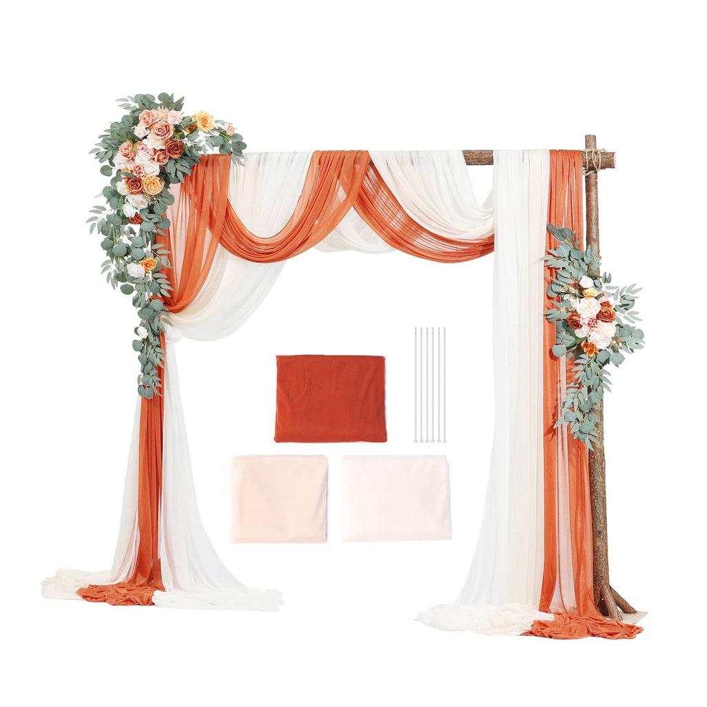 Artificial wedding arch drapes set with orange fabric and floral greenery corners