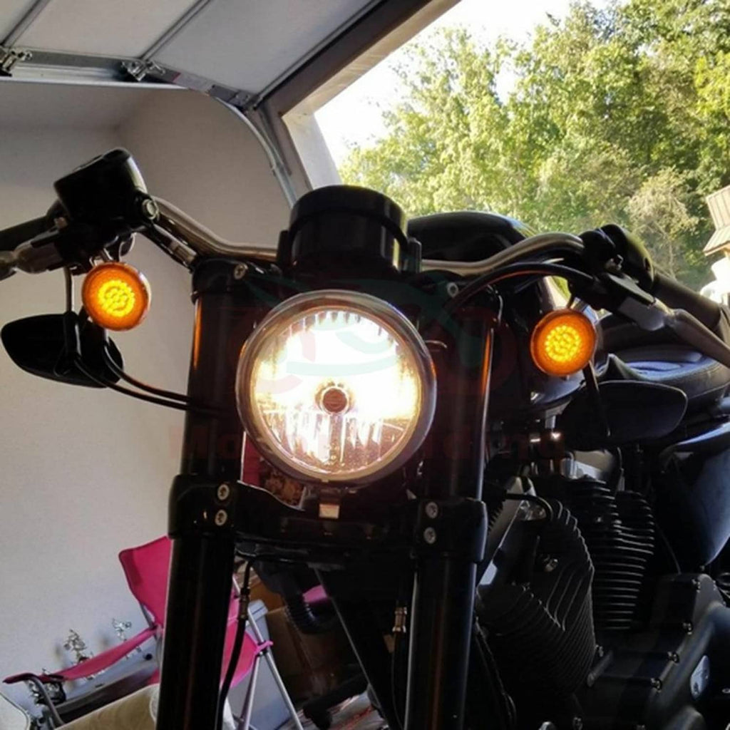 Motorcycle front turn signal lights with amber LED glow and silver lens housing