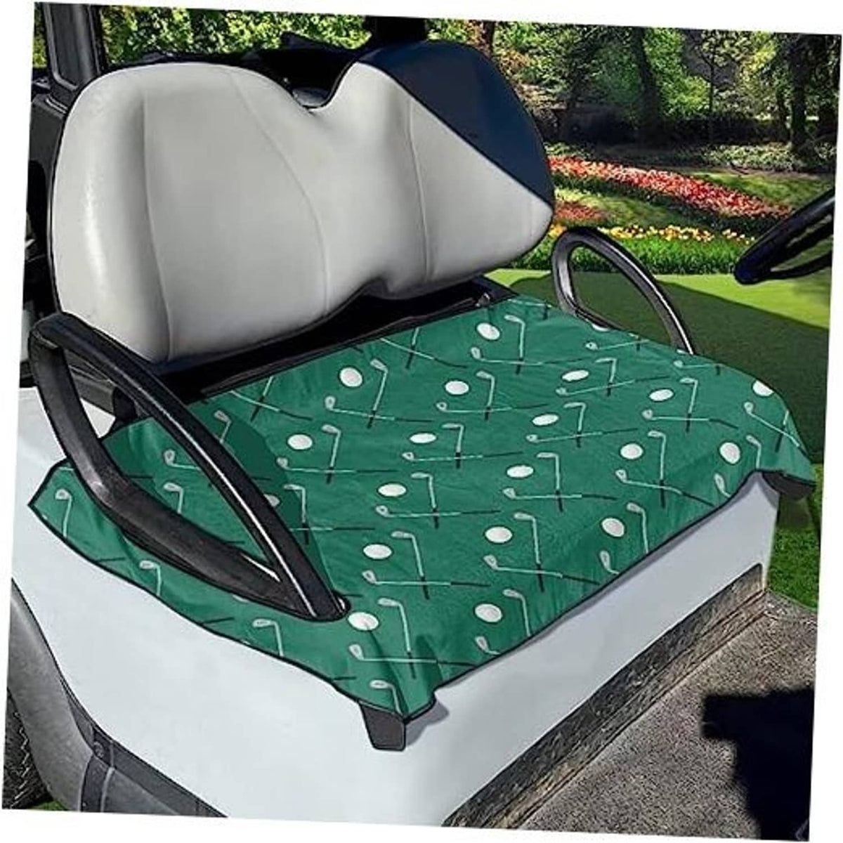 Green golf cart seat cover towel with white club pattern, laid over a beige seat
