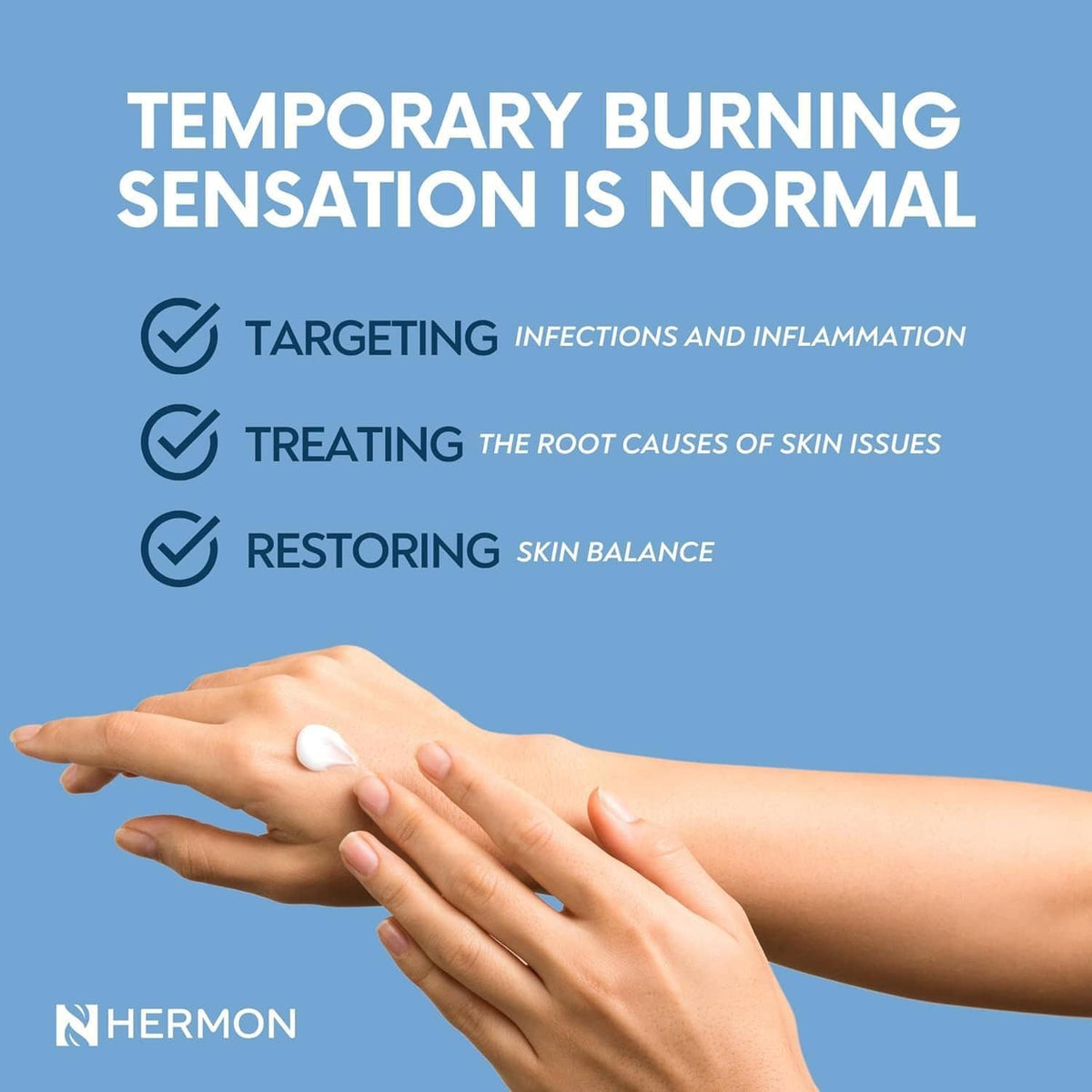 Hermon Jock Itch antifungal cream on fingertips, smoothing over arm skin