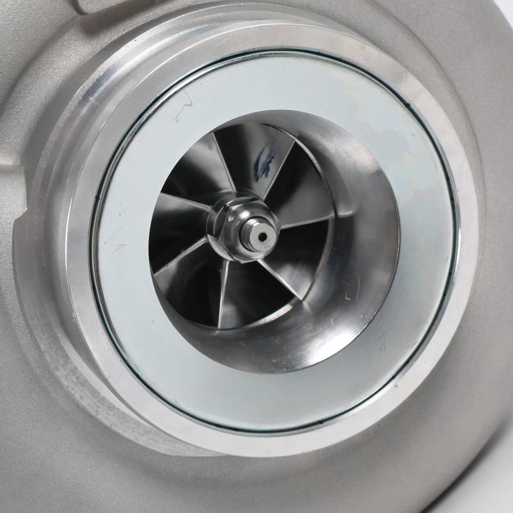 Close-up of turbo compressor wheel and blades inside the silver housing