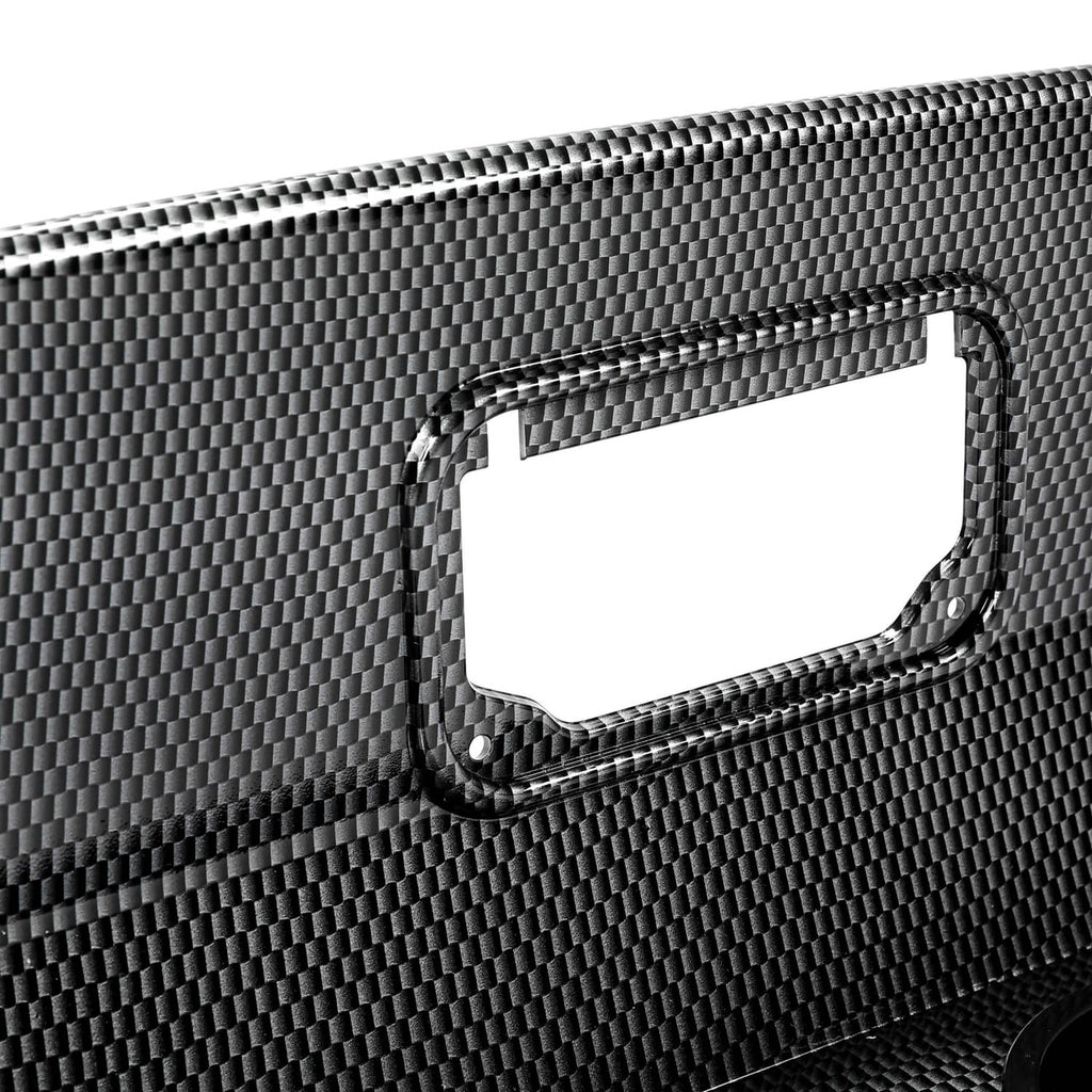 Close-up of carbon-fiber style dash cover edge with rectangular access cutout