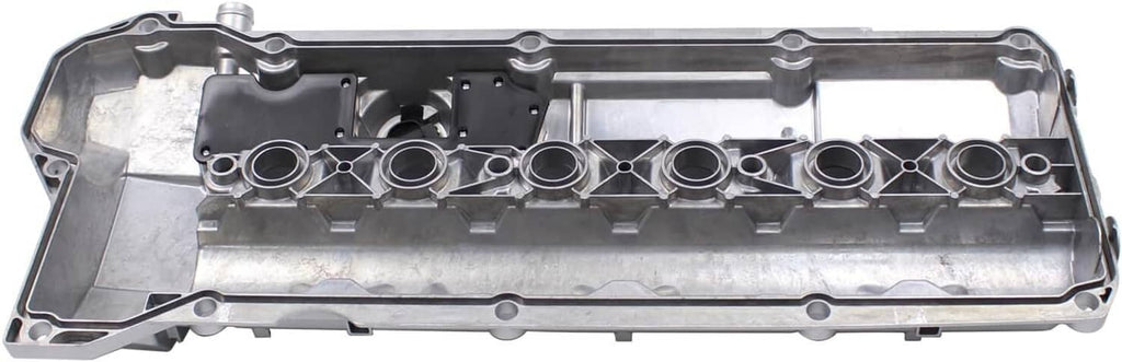 Valve cover gasket side with row of circular openings and internal baffle channels