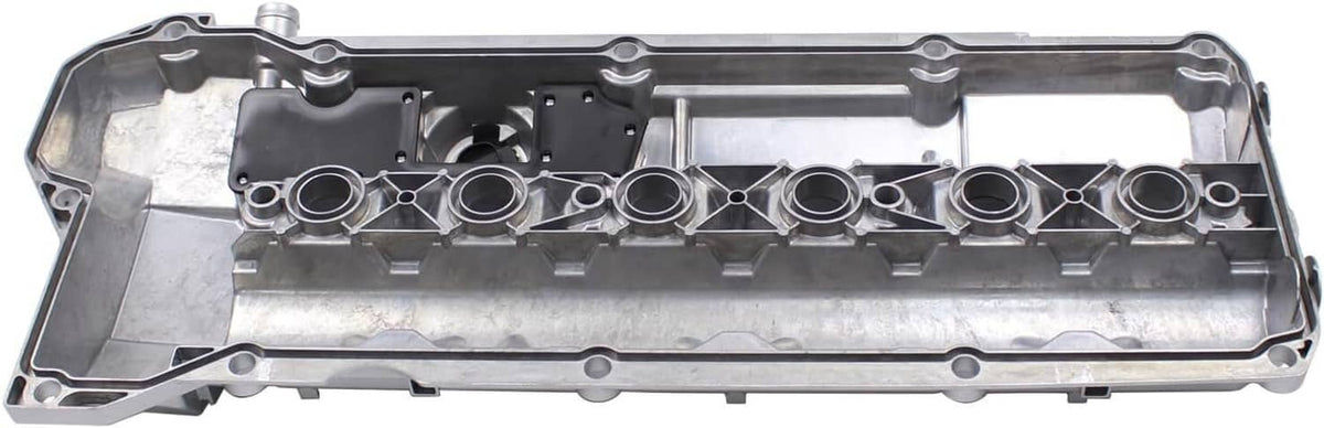 Valve cover gasket side with row of circular openings and internal baffle channels